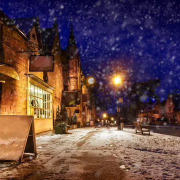 High Street at night during light snowfall, Broadway, Gloucestershire, the Cotswolds, England, United Kingdom