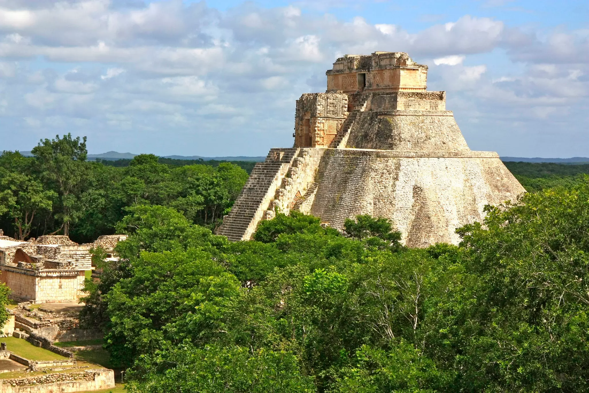 The Yucatán is dotted with Maya cities that showcase incredible architecture like the Temple of the Magician at Uxmal. P. Lubas / Getty Images