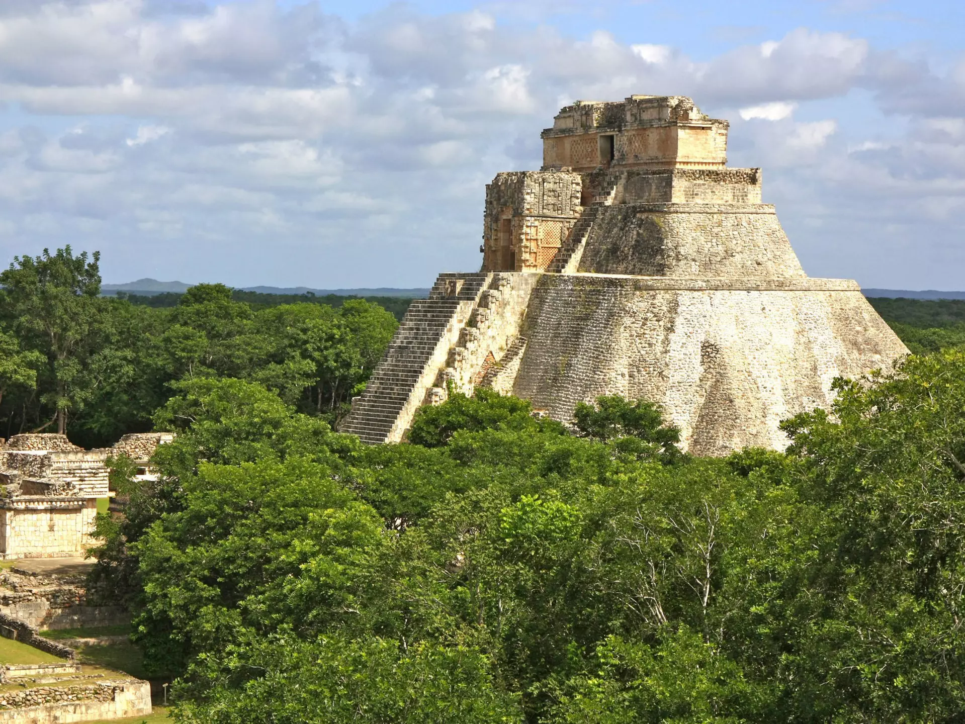The Yucatán is dotted with Maya cities that showcase incredible architecture like the Temple of the Magician at Uxmal. P. Lubas / Getty Images