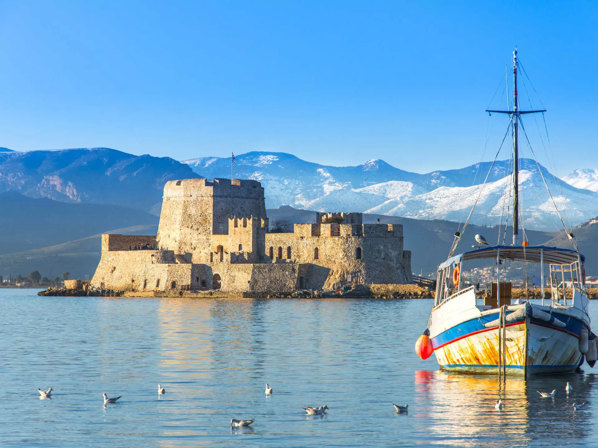 The island fortress of Bourtzi, in the harbor of Nafplio, Greece. Georgios Tsichlis/Alamy Stock Photo