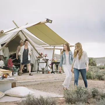 Group of friends enjoying an outdoor meal, a tent in the background.
664646215
Walking, Sitting, Standing, Caucasian Ethnicity, Mid Adult, 35-39 Years, 30-34 Years, Young Adult, 20-24 Years, Young Women, Mid Adult Women, Celebration, Enjoyment, Escape, Freetime, Real People, Relationship, Friendship, Bonding, Getting Away From It All, Sharing, Wellbeing, Remote, Small Group Of People, Four People, Smiling, USA, Utah, Candid, Full Length, Horizontal, Colour Image, Photography, Camera Focus, Selective Focus, Furniture, Table, Casual Clothing, Tent, Mountain, Summit, Wilderness Area, Desert, Sky, Cloud, Non-Urban Scene, Rural Scene, Day, Organic Food, Leisure, Lifestyles, Travel, Simple Living, The Good Life, Moab Desert, glamping