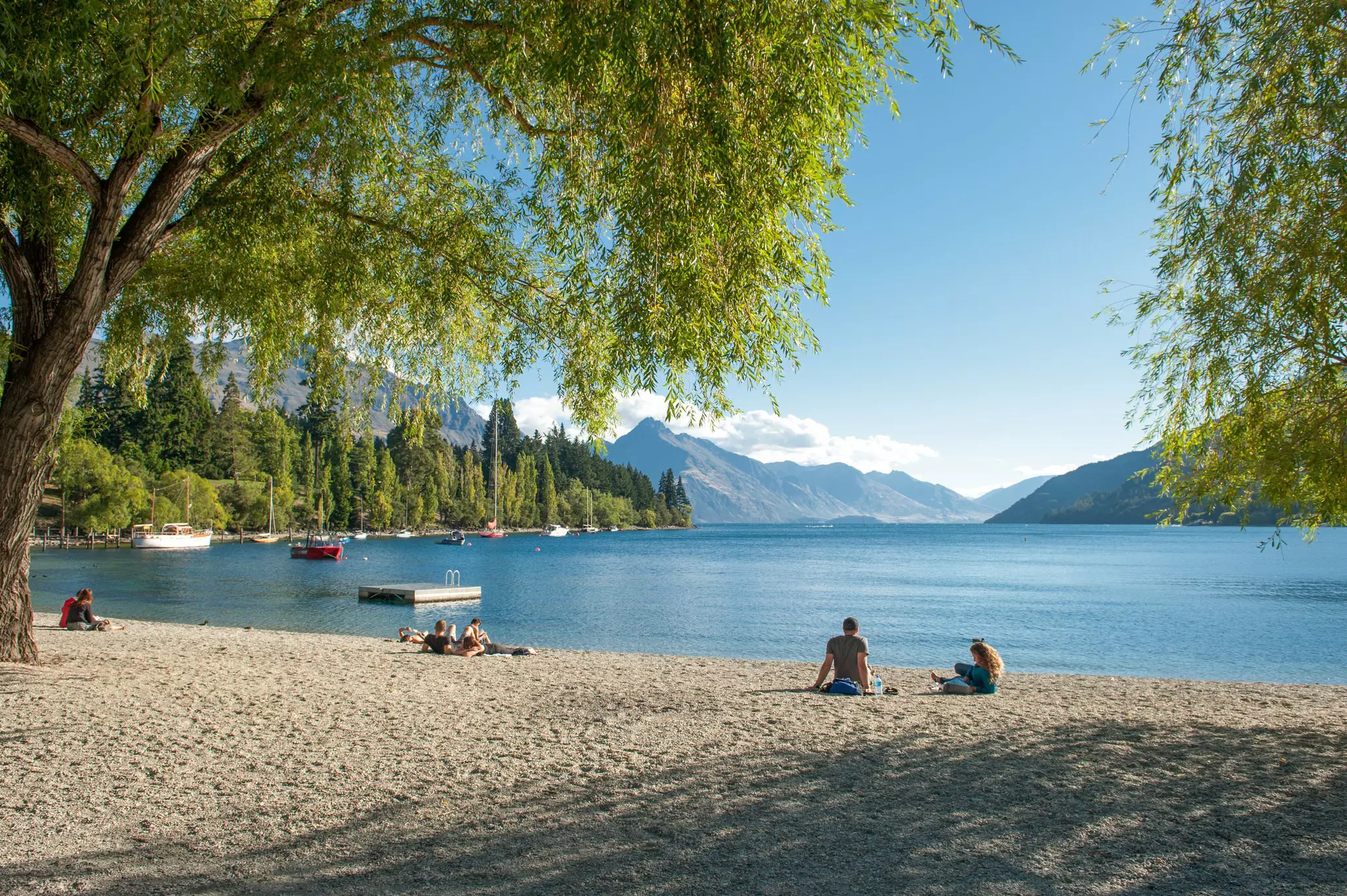 February 15, 2012: Visitors relax on the shore of Lake Wakatipu in Queenstown.
344887277
adventure, attraction, beautiful, countryside, hemisphere, island, lake, landscape, nature, new, oceania, otago, queenstown, relaxation, remote, rural, scenic, seascape, serene, south, southern, spectacular, tourism, tourist, tourists, tranquil, travel, wakatipu, zealand