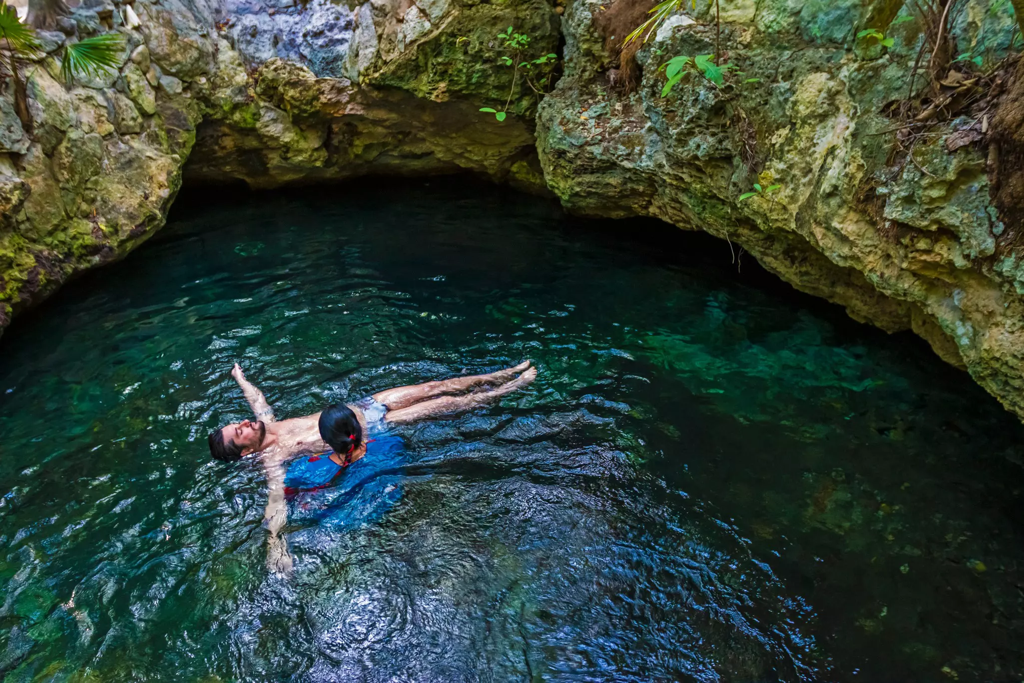 Man in ritual in Cancun cenote