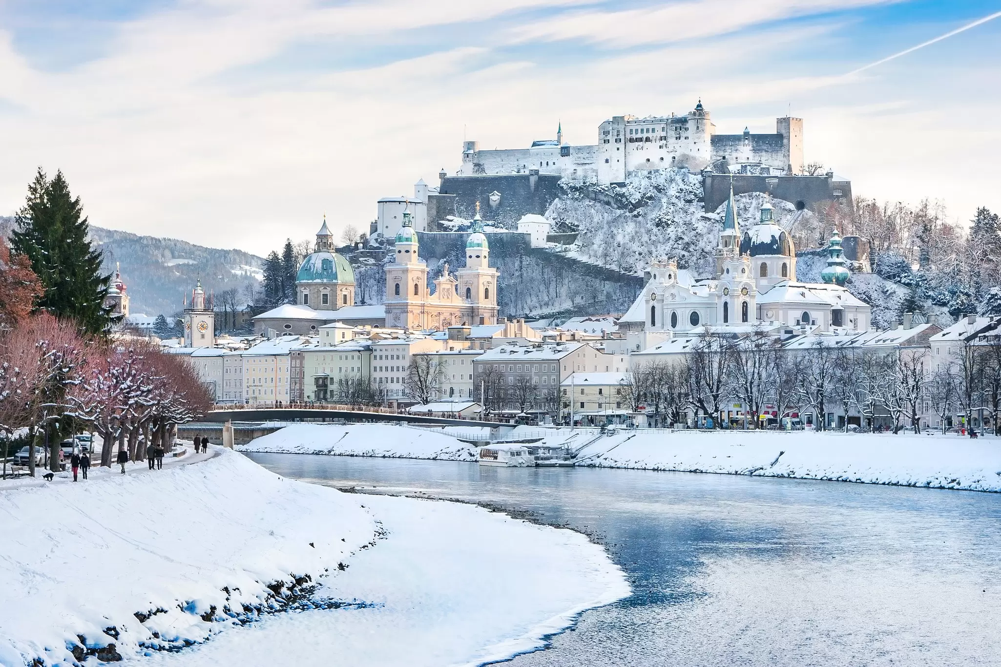 A wintry Salzburg skyline with Festung Hohensalzburg and the Salzach River. canadastock/Shutterstock