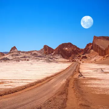 The moon rises above the amphitheatre, a geological formation in Moon Valley..