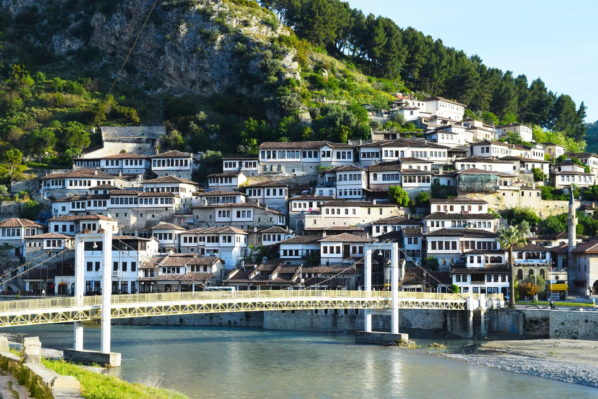 View of the traditional white houses in Berat across the bridge and over the river