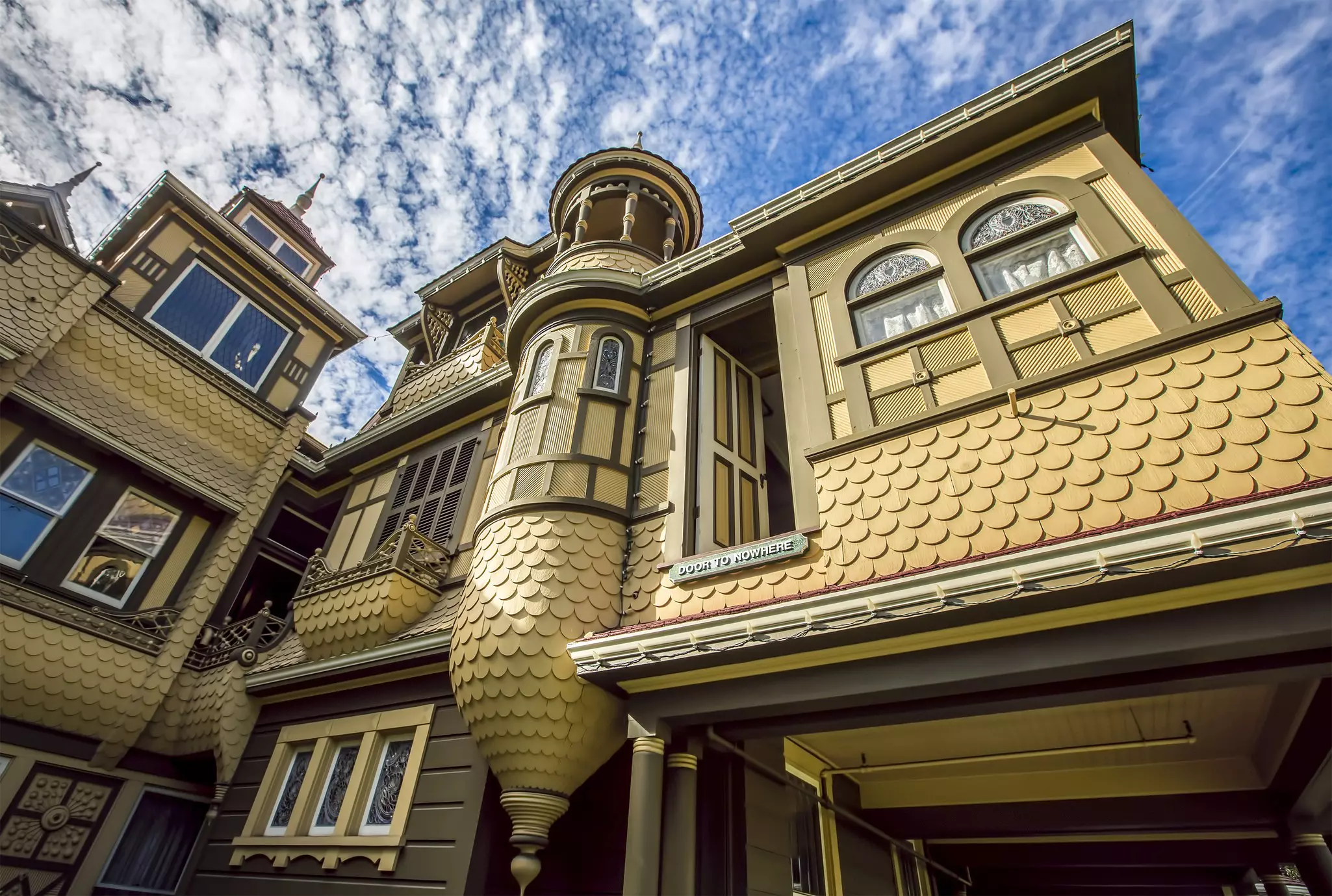 The Winchester Mystery House is filled with 160 mostly non-utilitarian rooms with dead-end hallways and a staircase that runs up to a ceiling © CREATISTA / Shutterstock