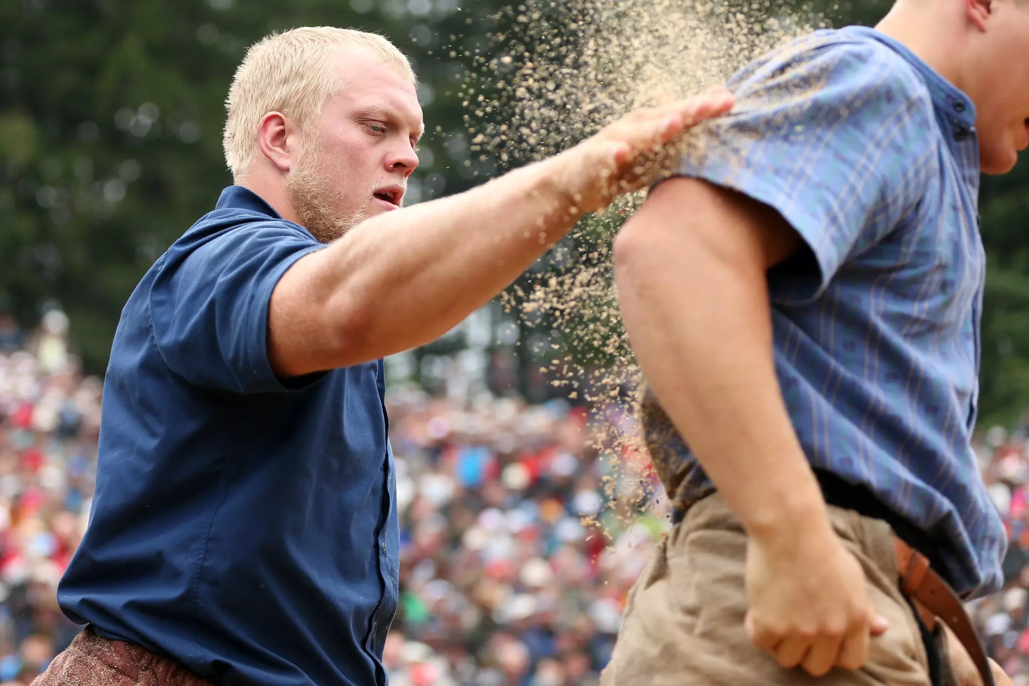 Schwingen wrestler Lutz Scheuber cleans the back of his opponent after a victory © Philipp Schmidli / Getty Images