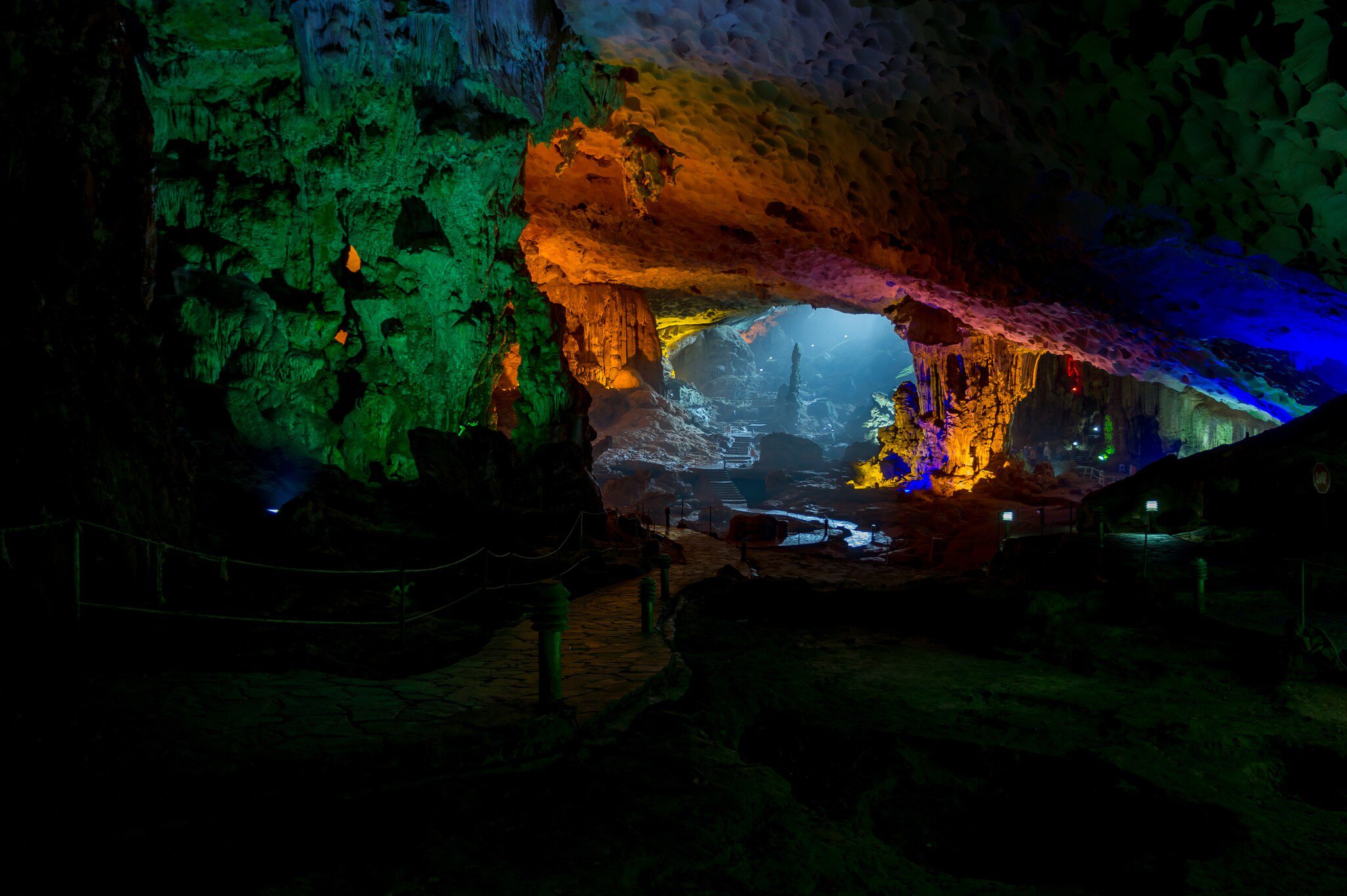 Amazing cave at Halong Bay illuminated by a variety of vibrant colors.