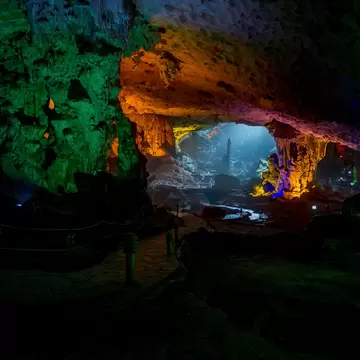Amazing cave at Halong Bay illuminated by a variety of vibrant colors.