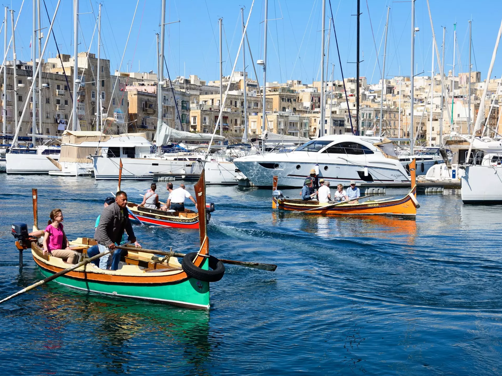 Passengers on traditional Maltese Dghajsa water taxis crossing the harbor at Birgu
920409452
dghajsa, dghajsa tal-pass, luzzu