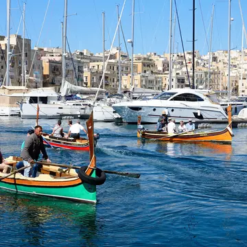 Passengers on traditional Maltese Dghajsa water taxis crossing the harbor at Birgu
920409452
dghajsa, dghajsa tal-pass, luzzu