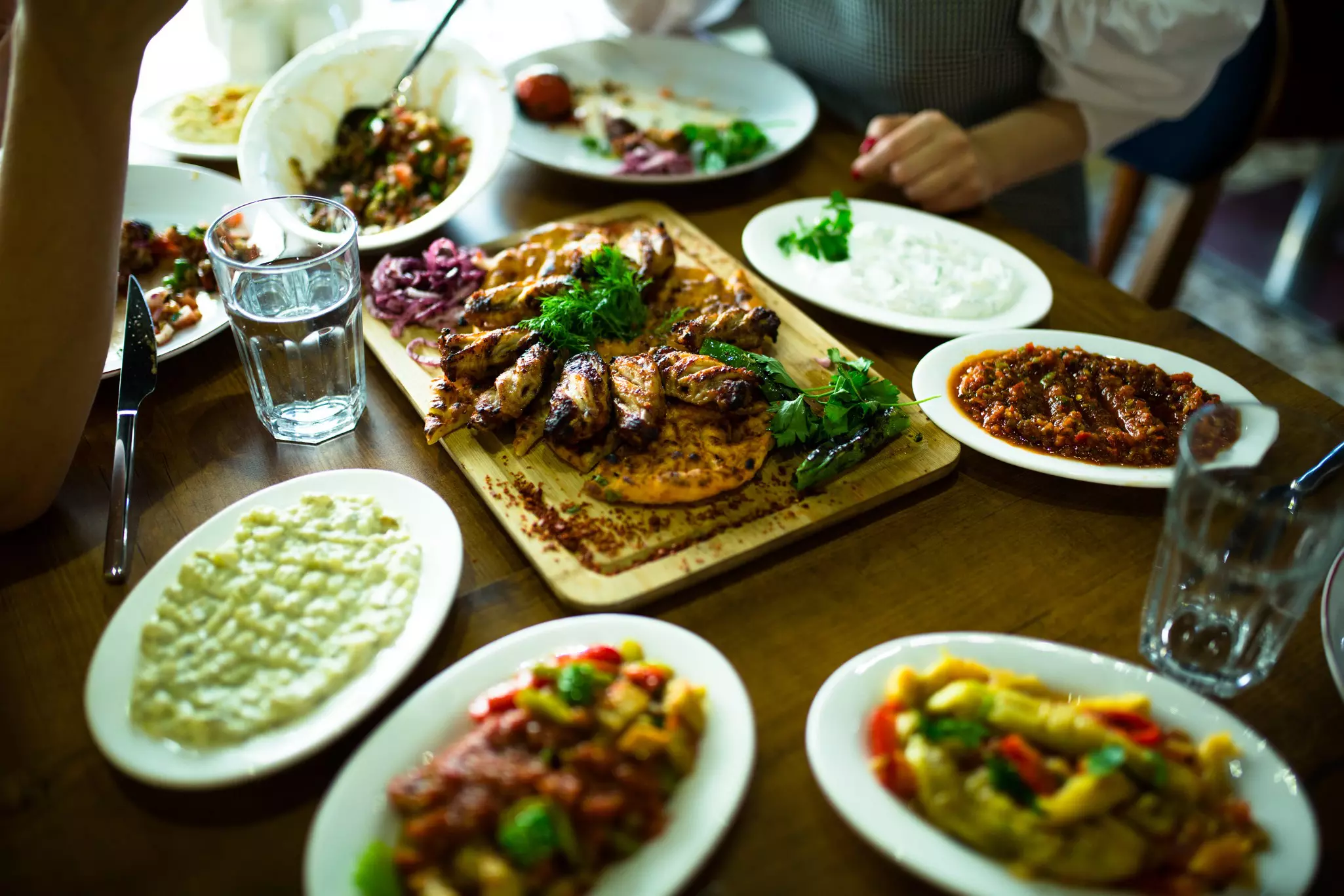 Traditional Azerbaijani dish. Background of food. Amazing Lunch. Restaurant table with food. Atmosphere of Baku and Eastern traditions. Oriental cuisine. Cozy atmosphere in the caucasus cafe.