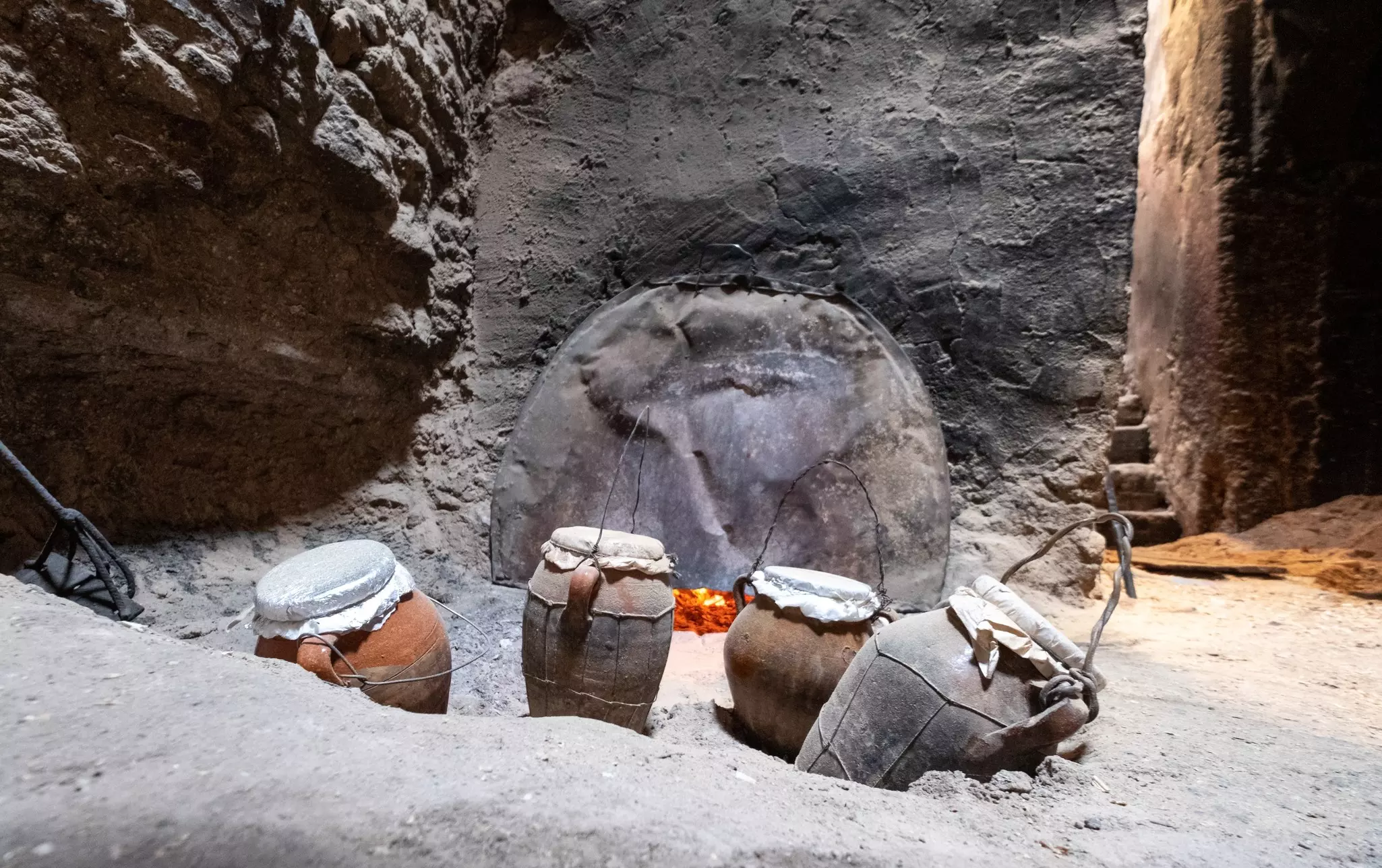 Tanjia cooking vessels deep in ash, heated by the adjacent hammam hot baths. Lois GoBe/Shutterstock