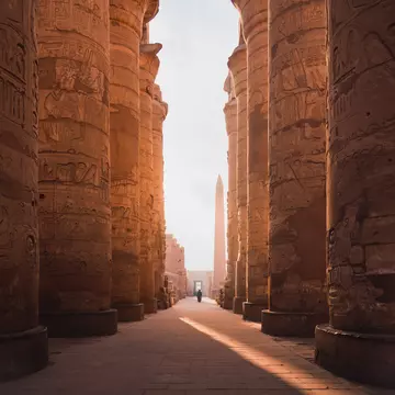 ancient corridor and columns of Karnak temple complex in Luxor city Egpyt during sunrise