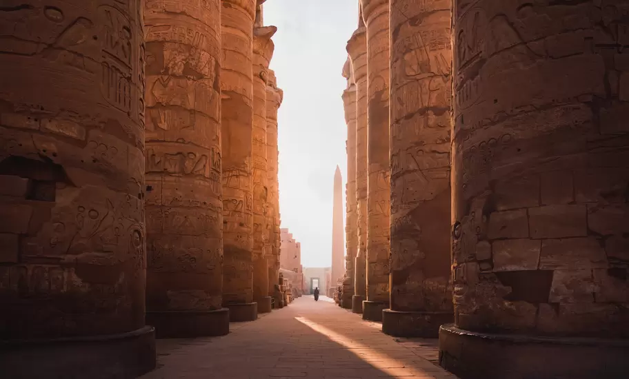 ancient corridor and columns of Karnak temple complex in Luxor city Egpyt during sunrise