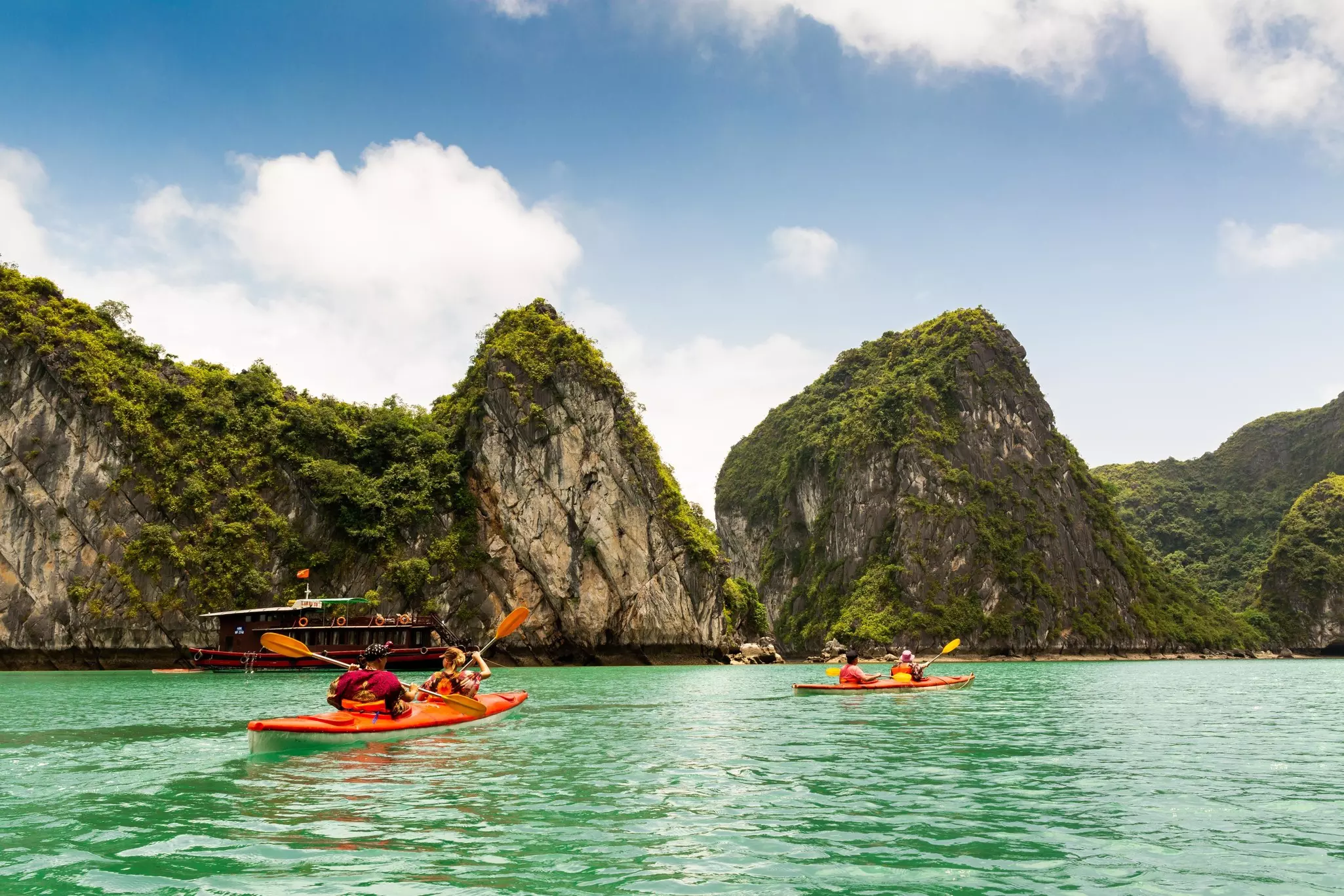 Two kayaks paddling in Halong Bay, Vietnam.