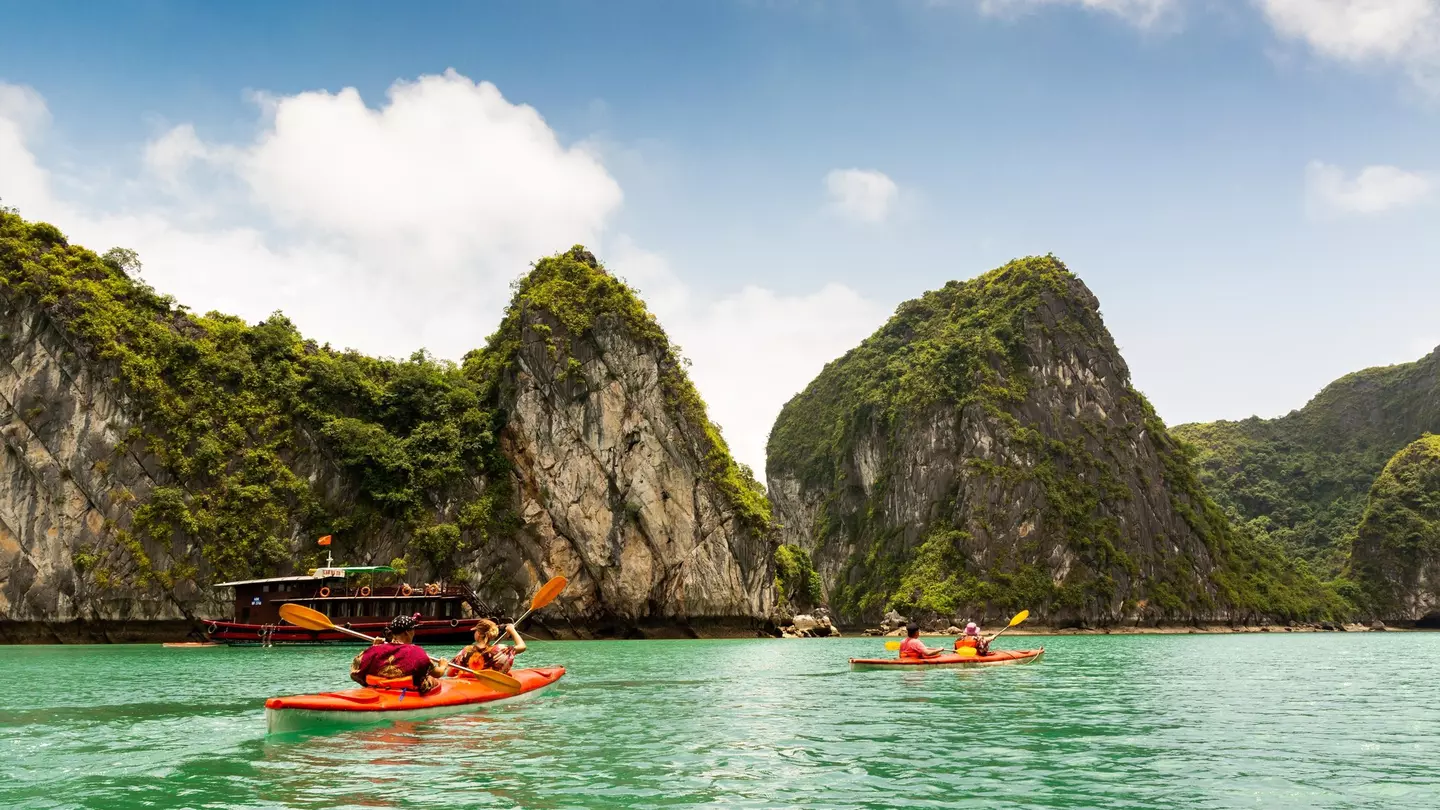 Two kayaks paddling in Halong Bay Vietnam