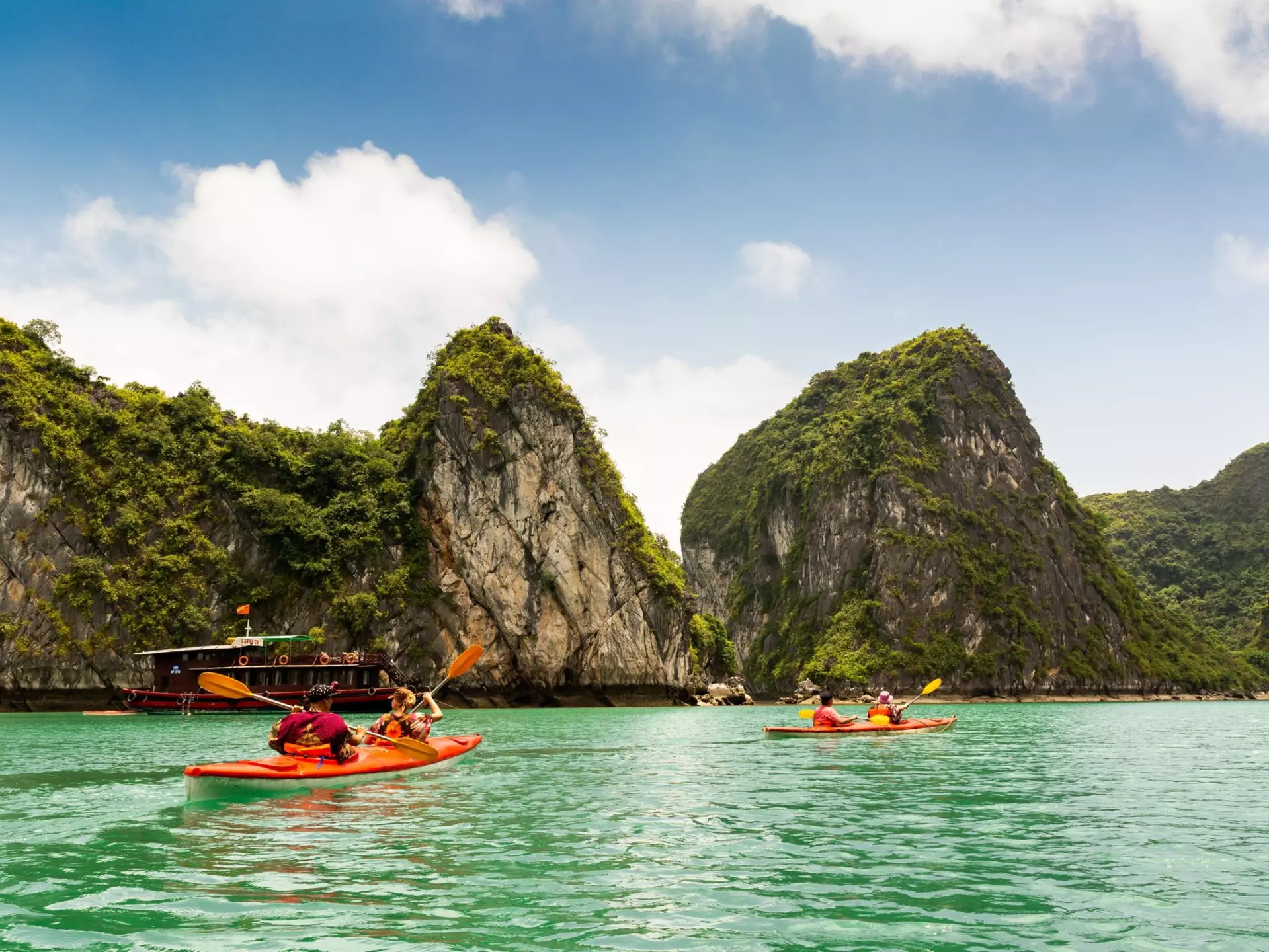 Two kayaks paddling in Halong Bay Vietnam