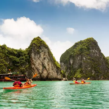 Two kayaks paddling in Halong Bay Vietnam