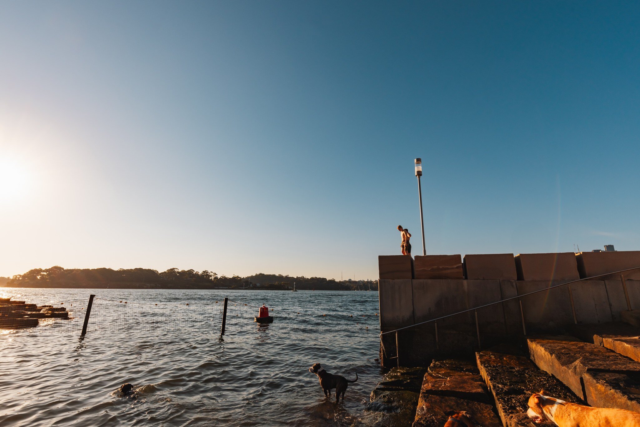 Standing on ledge at Marrinawi Cove in bright afternoon sunshine. Sydney, Australia.