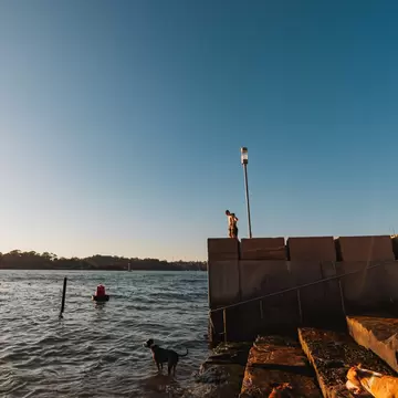 Standing on ledge at Marrinawi Cove in bright afternoon sunshine. Sydney, Australia.