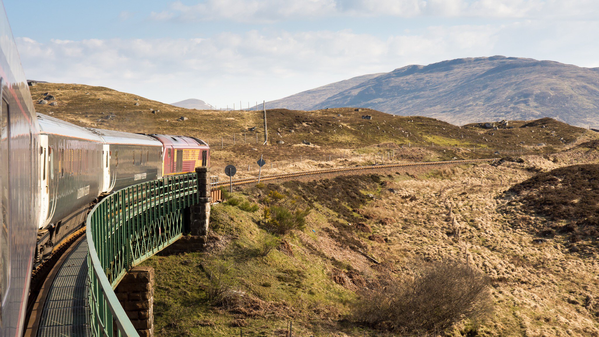 The Caledonian Sleeper train trundles through the Highlands of Scotland.