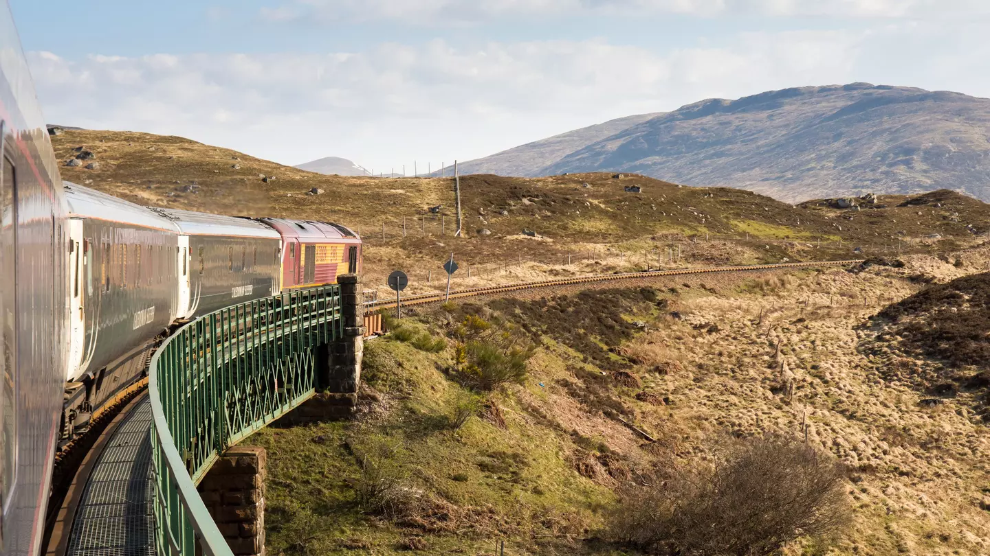 The Caledonian Sleeper train trundles through the Highlands of Scotland.