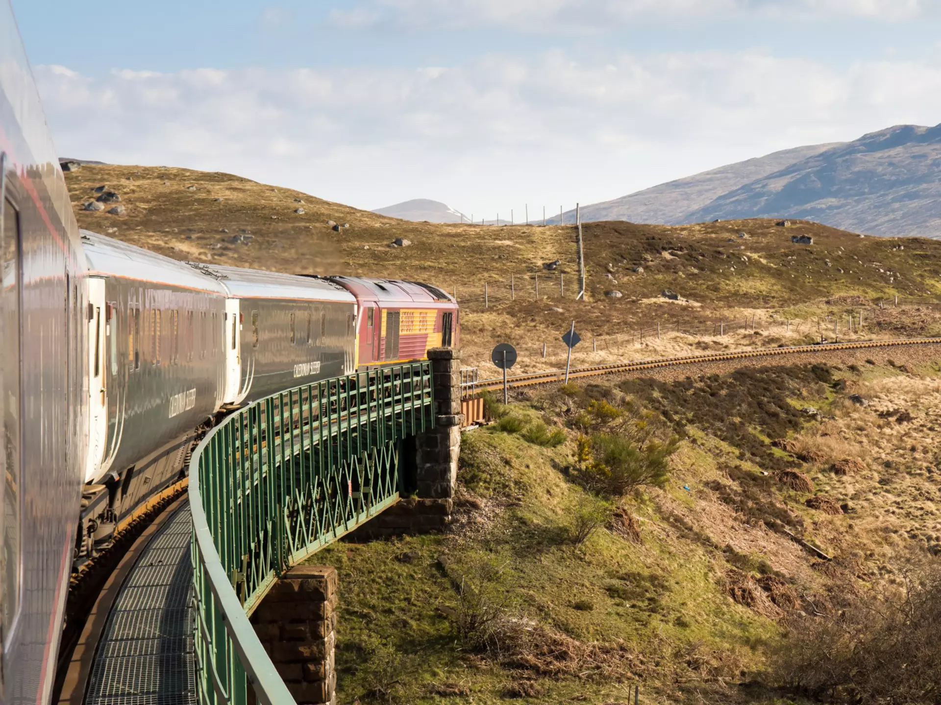 The Caledonian Sleeper train trundles through the Highlands of Scotland.