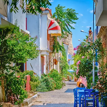 Colorful flower-filled street lined with beautiful old houses
