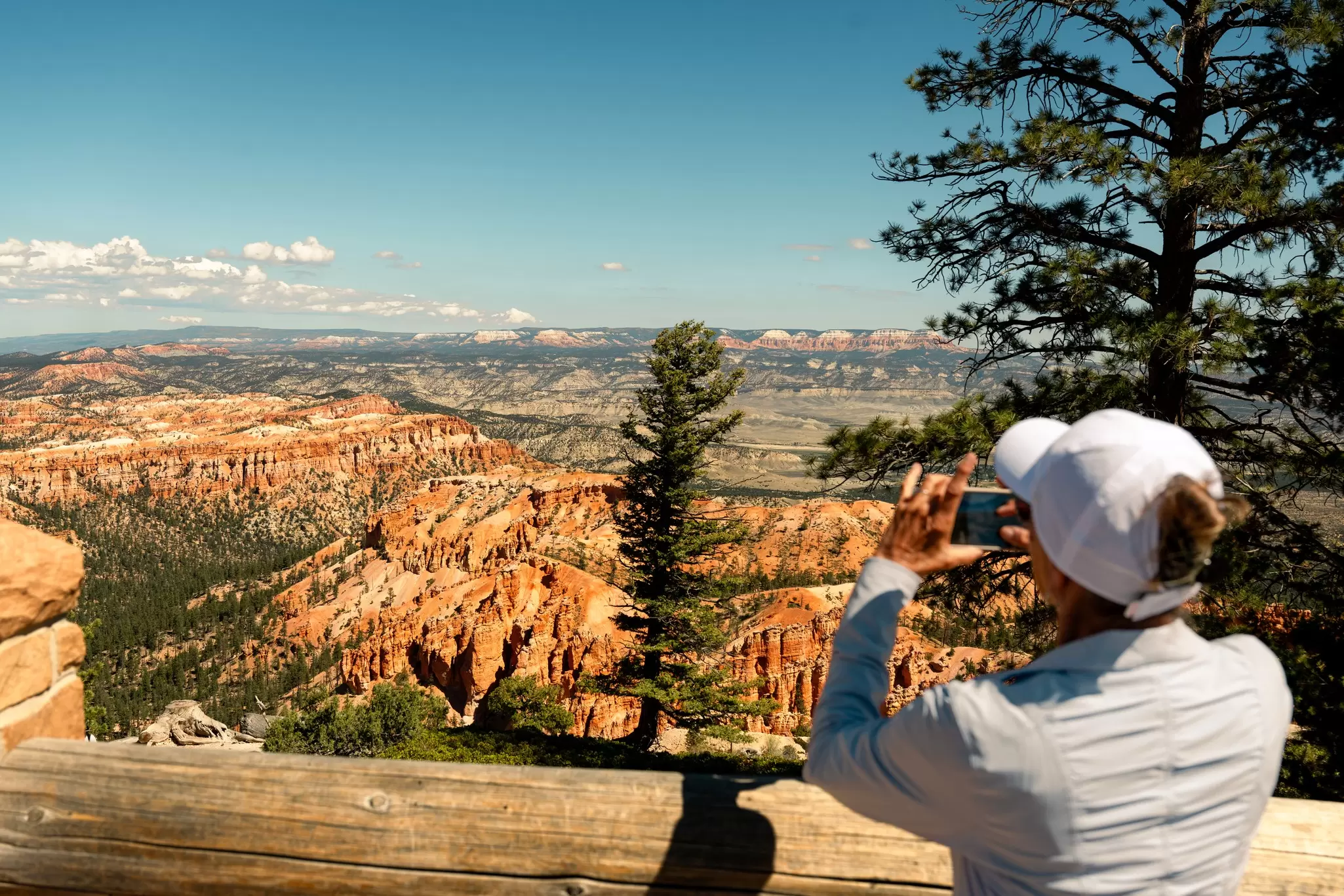 A visitor takes a photo at Bryce Canyon National Park, Utah