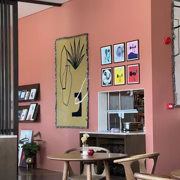 Poached eggs dressed with scallion garnish and a tomato sauce