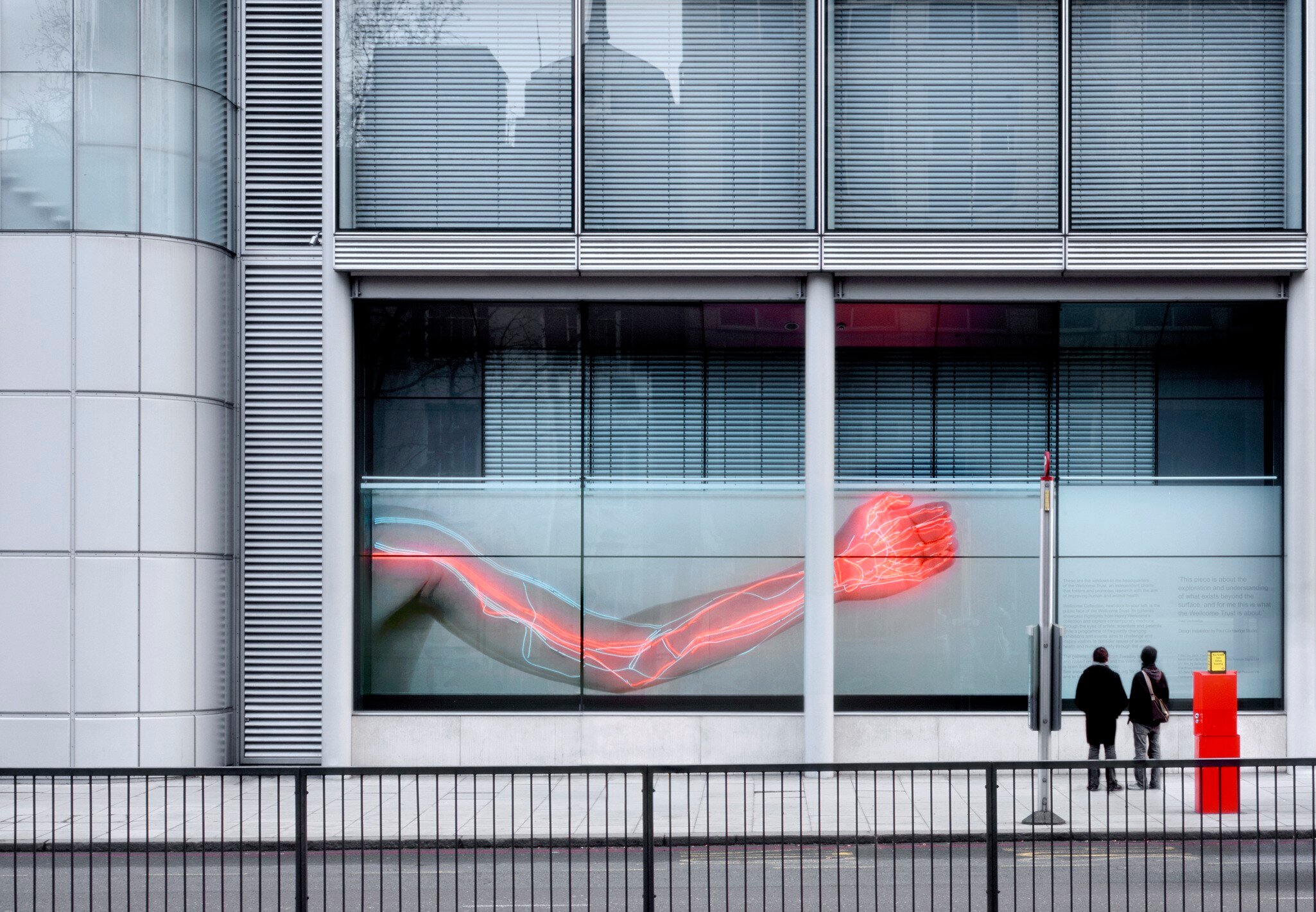 WELLCOME TRUST GIBBS BUILDING   Tight view of people looking at 2008 Wellcome Trust window installation