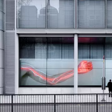 WELLCOME TRUST GIBBS BUILDING   Tight view of people looking at 2008 Wellcome Trust window installation