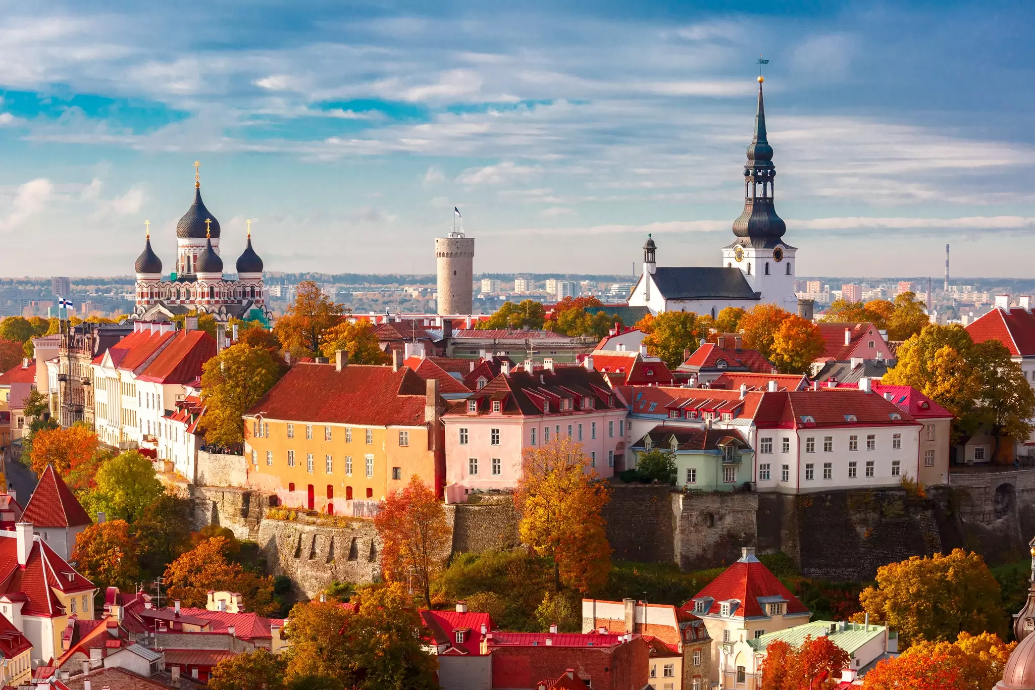 Autumn view over Tallinn's Old Town with church spires and red-tiled rooftops