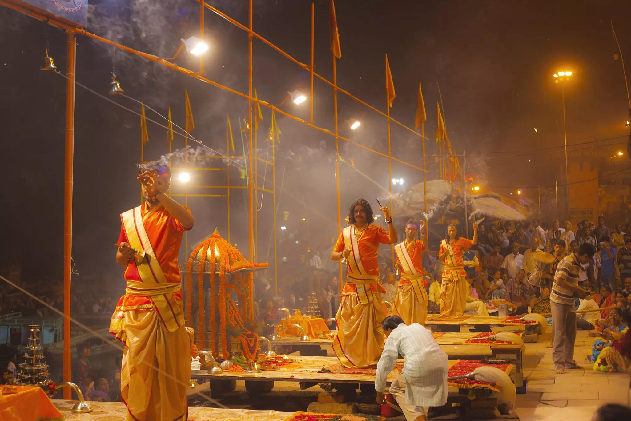 An unidentified Hindu priest performs religious Ganga aarti ritual (fire puja) at Dashashwamedh Ghat in Varanasi, India