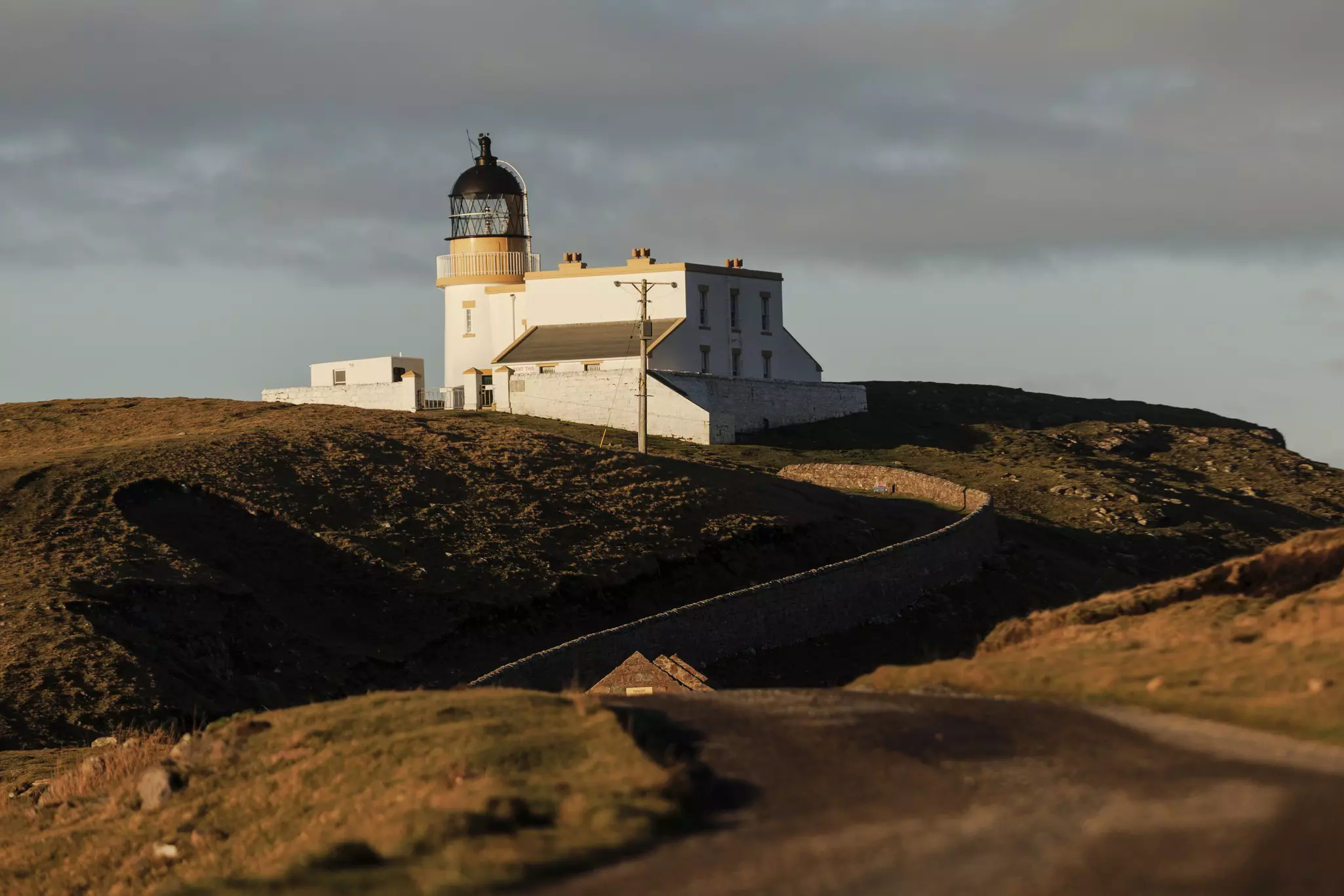 A view of Stoer Lighthouse and surrounds on the NC500 driving route in Scotland.