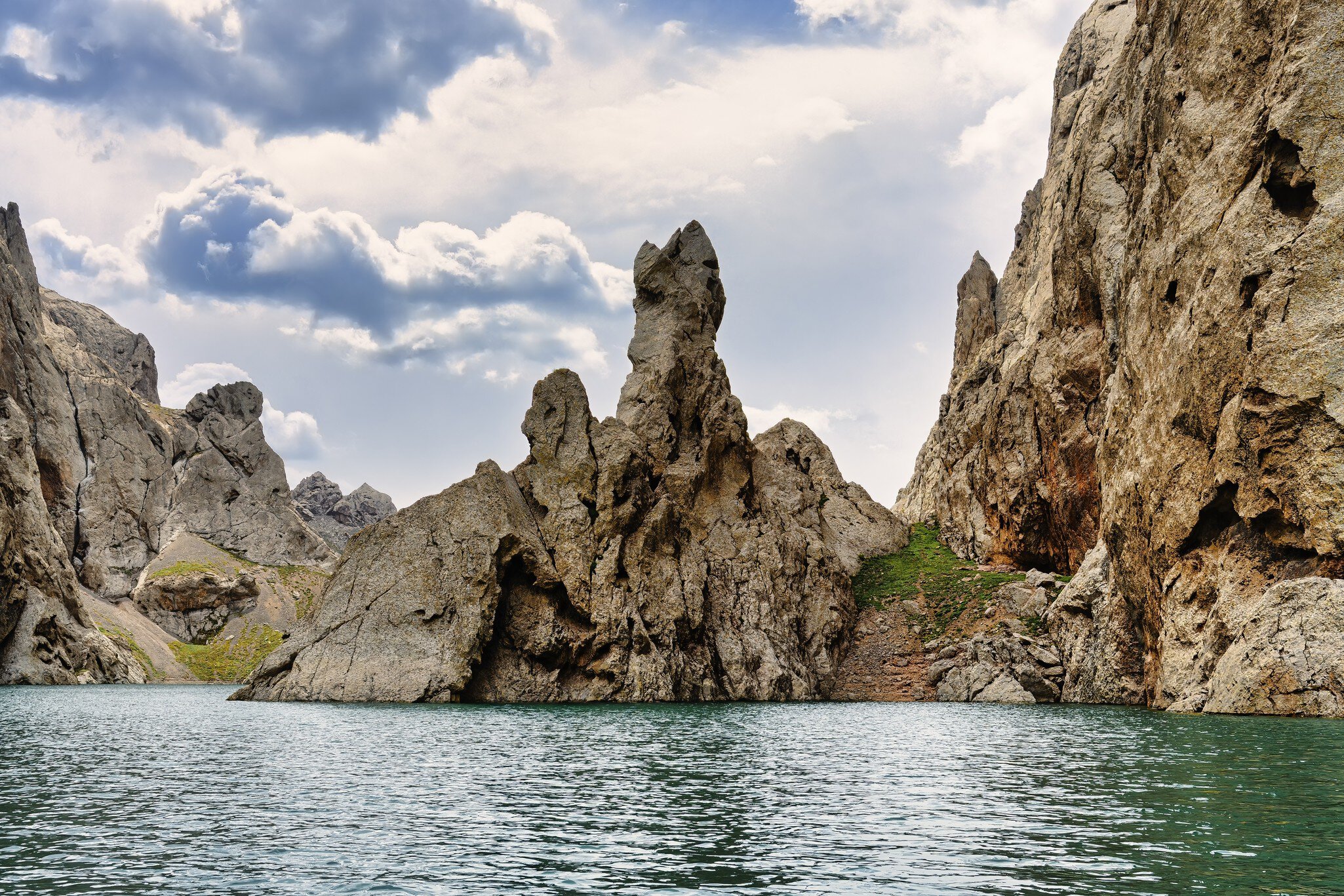Rock formation around the alpine Köl-Suu lake, Kurumduk valley, Naryn province, Kyrgyzstan; Shutterstock ID 2255076413; your: Sloane Tucker; gl: 65050; netsuite: Online Editorial; full: POI