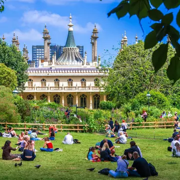 Illuminated Brighton Pavilion building at dusk, Brighton, Sussex, United Kingdom
