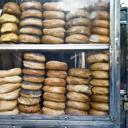 Stacks of bagels in a window. 