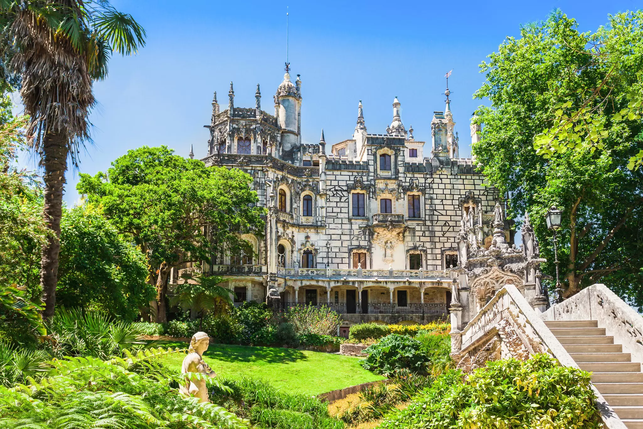 Exterior view of the Quinta da Regaleira on a sunny day in Sintra, Portugal.