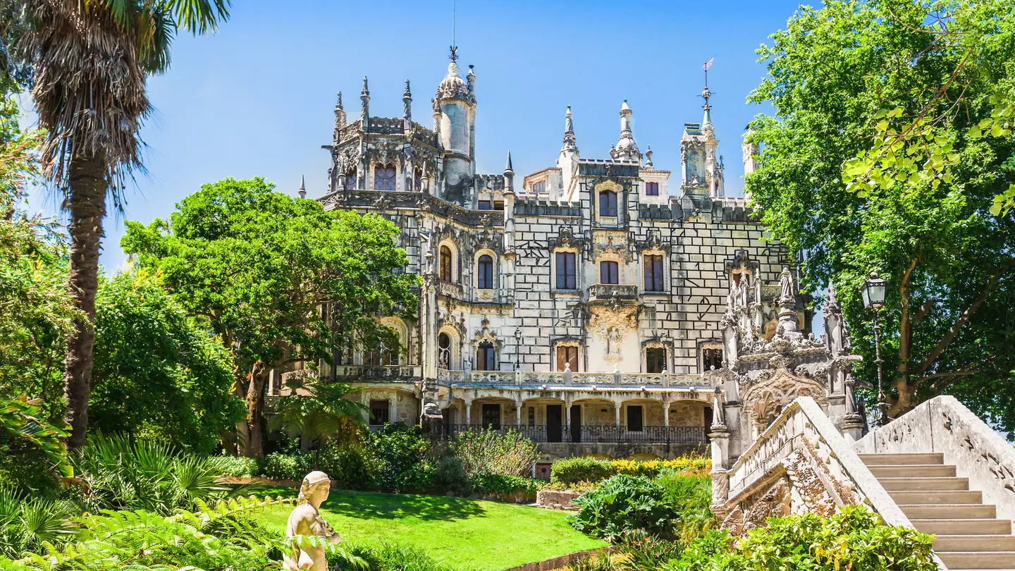 Exterior view of the Quinta da Regaleira on a sunny day in Sintra, Portugal.