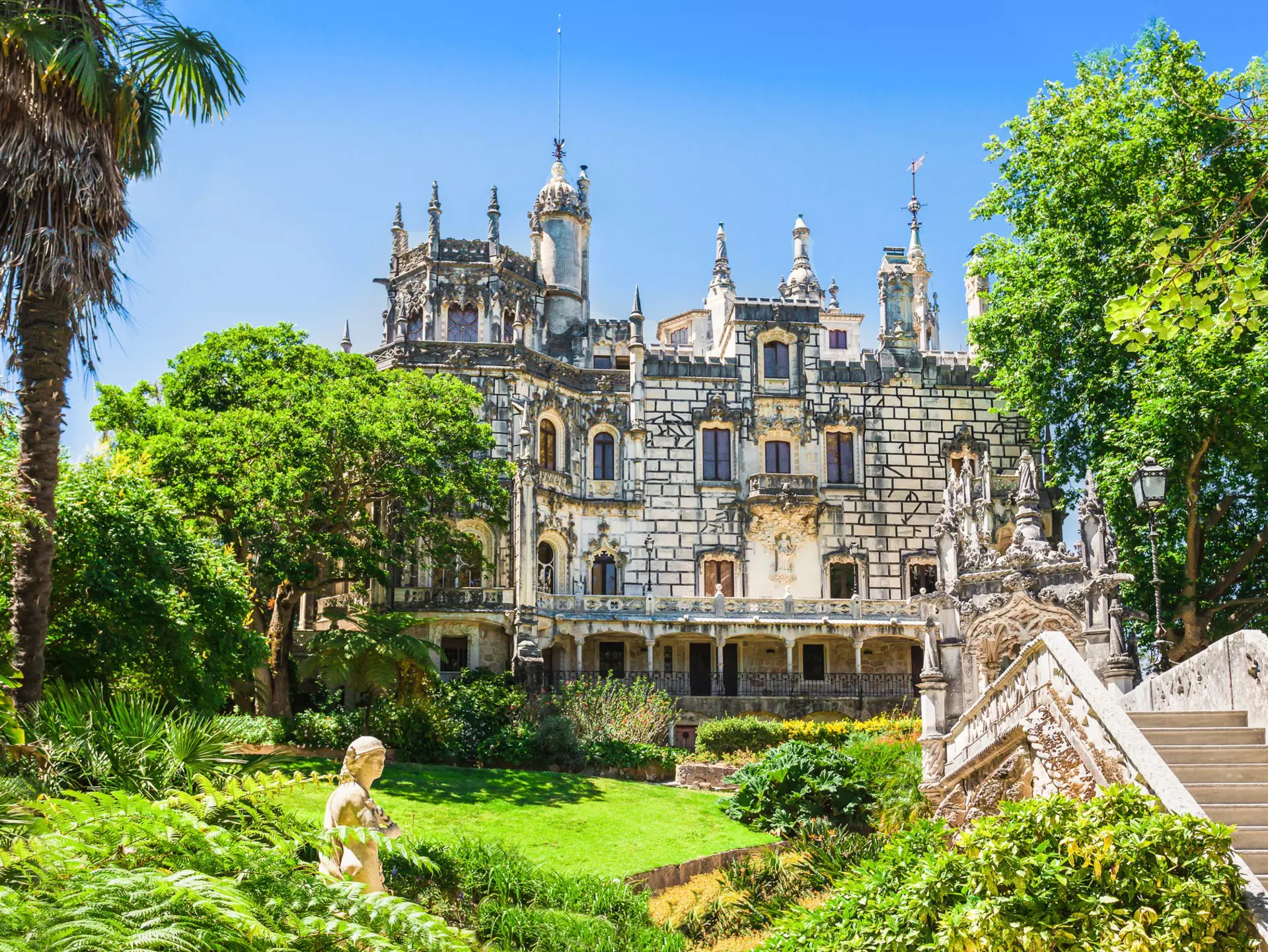 Exterior view of the Quinta da Regaleira on a sunny day in Sintra, Portugal.
