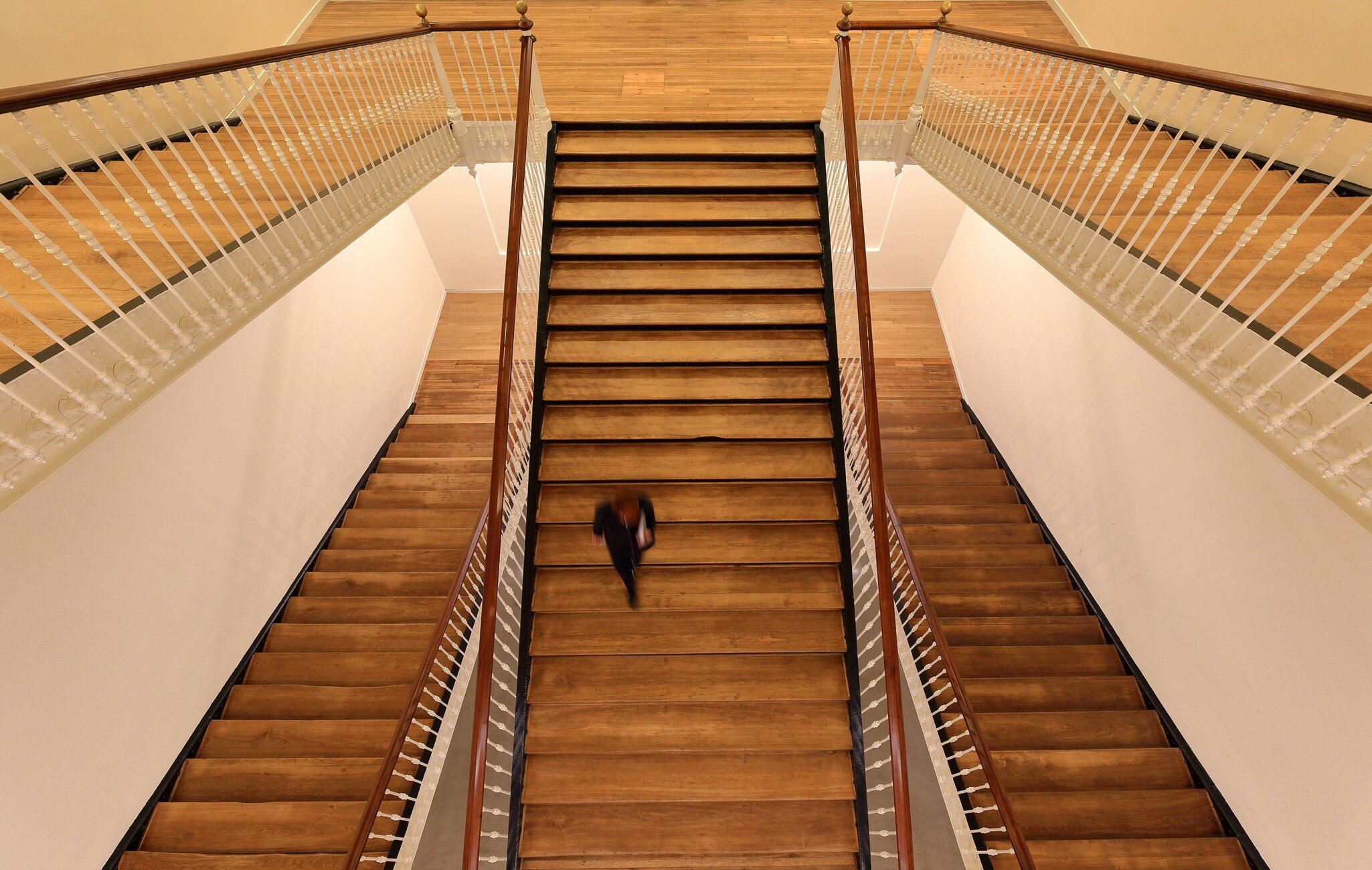 A visitor walks down the stairs at the Tabakalera cultural center in San Sebastián, Spain.
