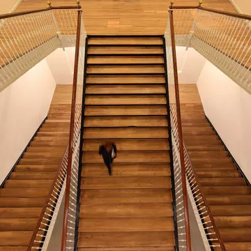 A visitor walks down the stairs at the Tabakalera cultural center in San Sebastián, Spain.