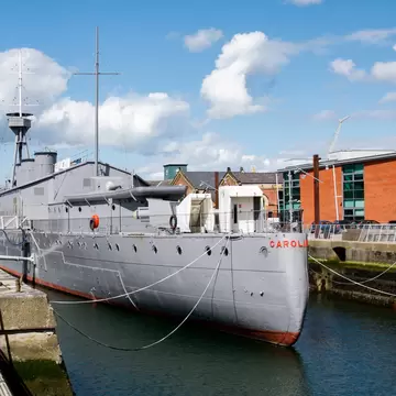 Stern view of the HMS Caroline, a restored World War 1 battleship moored in the Titanic Quarter. 