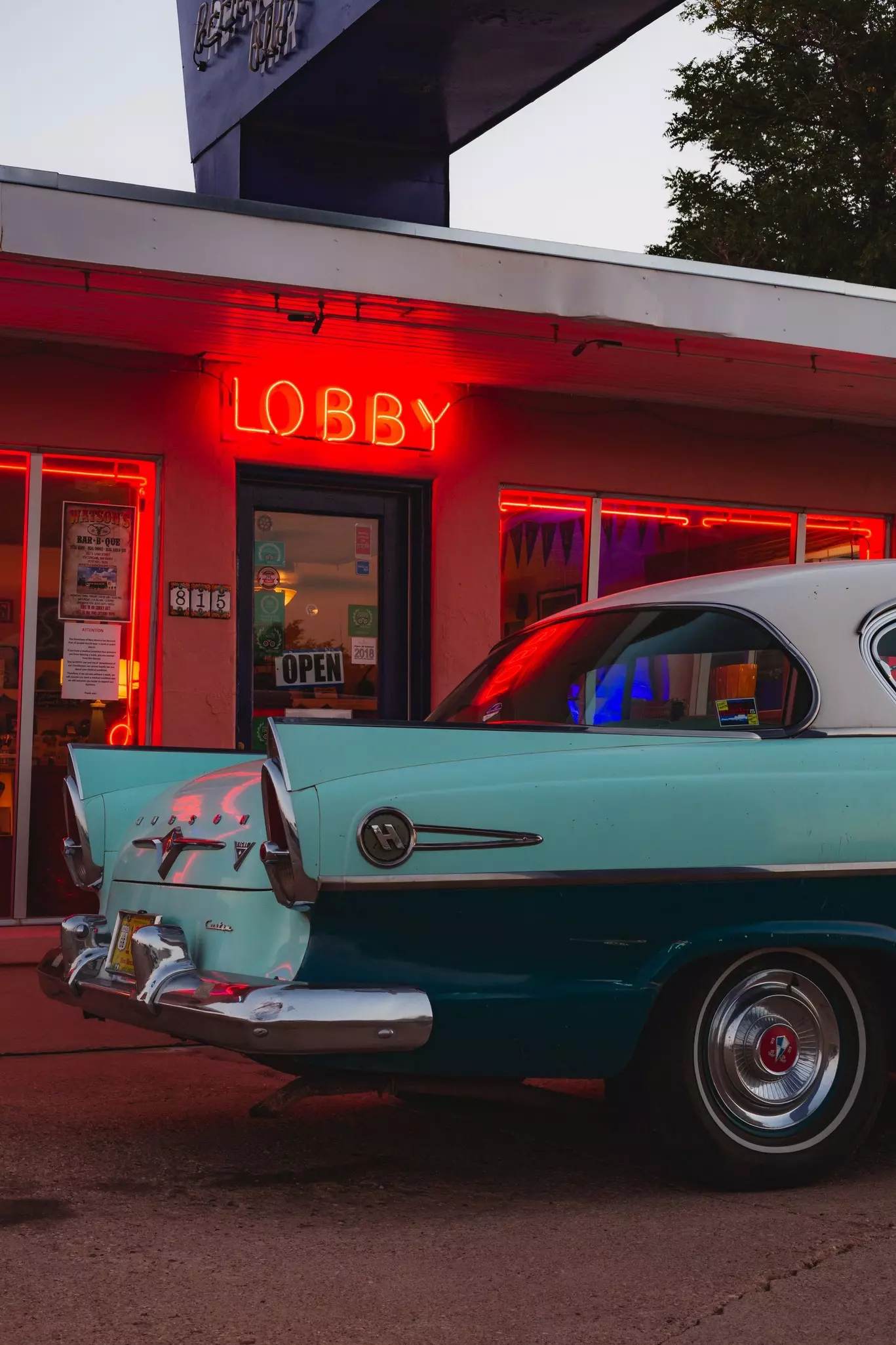 The back fins of a vintage car at the famous Blue Swallow Motel on Route 66.