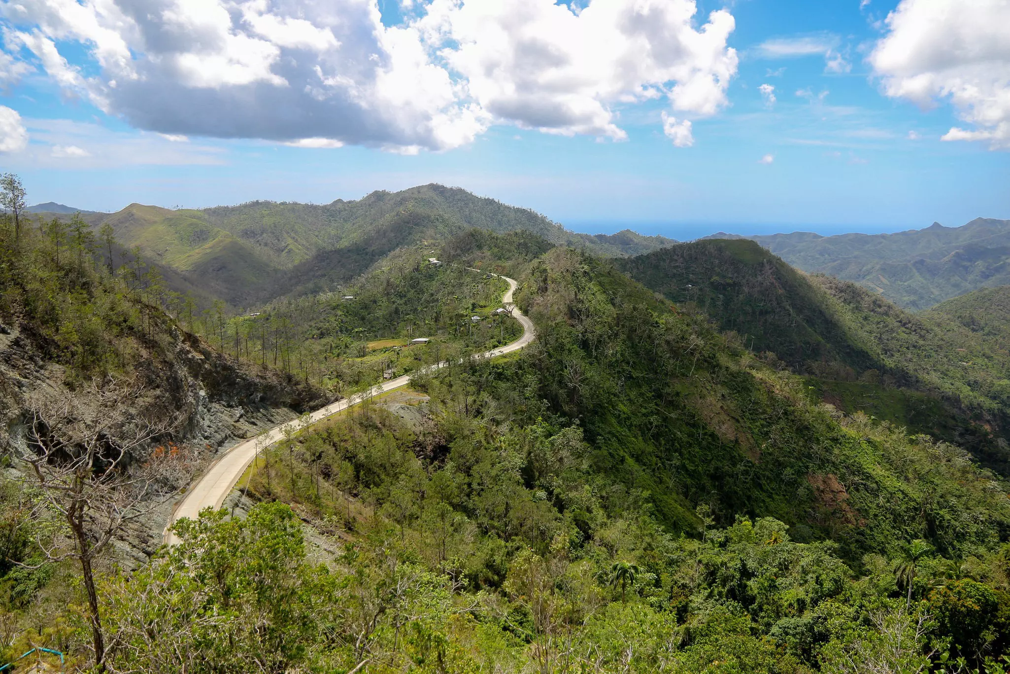 La Farola road cuts across the top of green hills between Santiago and Baracoa in Cuba