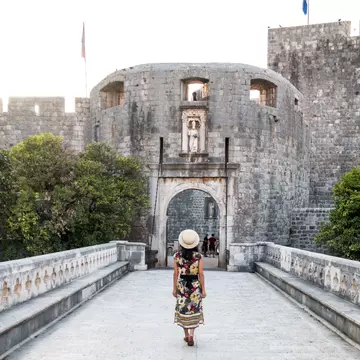 Woman Walking Towards Pile Gate Entrance to Old Town Dubrovnik - stock photo
architecture, building, castle, street, urban, road, city, bridge, arch, fort, Croatia, Dubrovnik, old town, gate, Pile Gate