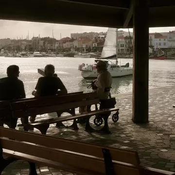 Locals sit beside the canal in Les Sables d'Olonne. Ann Douglas Lott/Lonely Planet